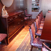 Indian rosewood and brass inlaid side cabinet, dining table and chairs